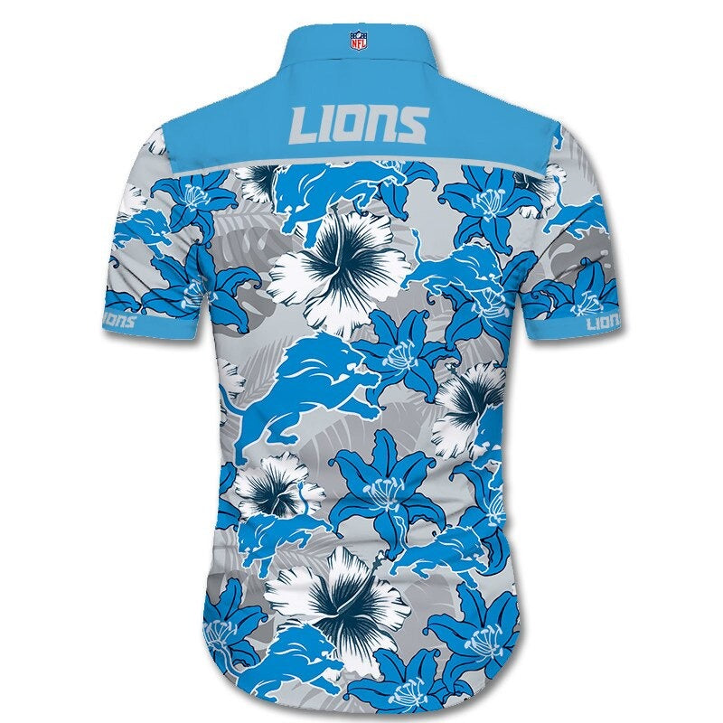 Back view of Detroit Lions Hawaiian Shirt featuring bold team name and logo, tropical hibiscus floral pattern, BLUE shoulder panel, men's short-sleeve button-down.