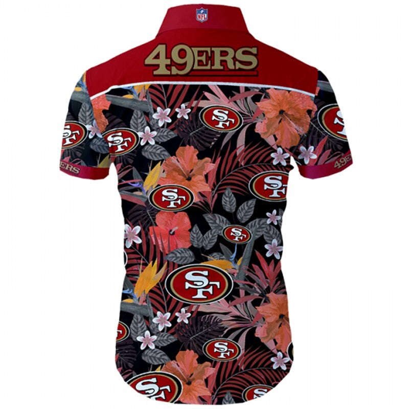 Back view of San Francisco 49ers Hawaiian Shirt featuring bold team name and logo, tropical hibiscus floral pattern, RED shoulder panel, men's short-sleeve button-down.