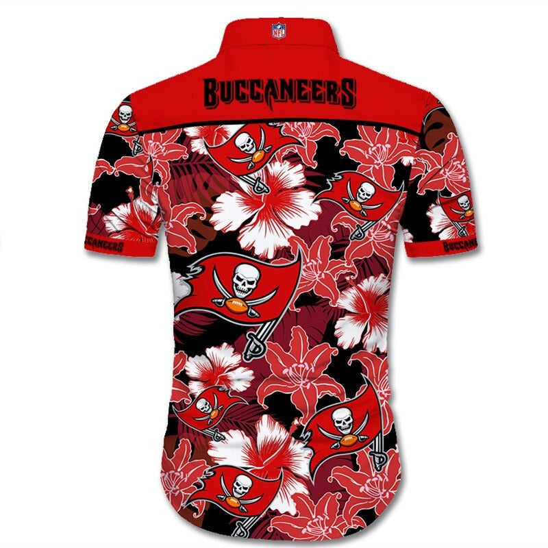 Back view of Tampa Bay Buccaneers Hawaiian Shirt featuring bold team name and logo, tropical hibiscus floral pattern, RED shoulder panel, men's short-sleeve button-down.