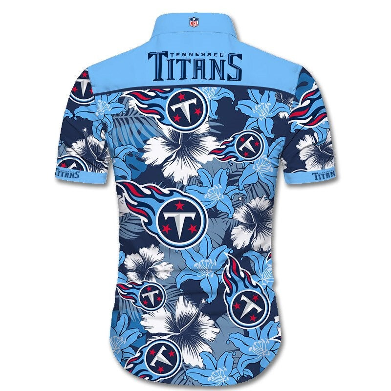 Back view of Tennessee Titans Hawaiian Shirt featuring bold team name and logo, tropical hibiscus floral pattern, NAVY BLUE shoulder panel, men's short-sleeve button-down.