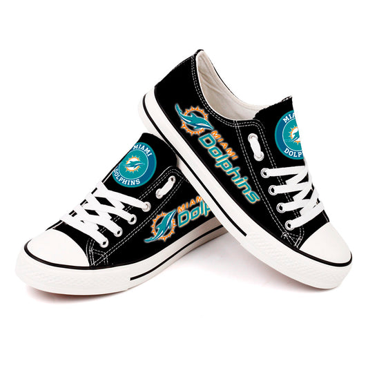 A pair of black canvas Miami Dolphins sneakers with teal laces, perfect for showing team spirit in a casual and comfortable way